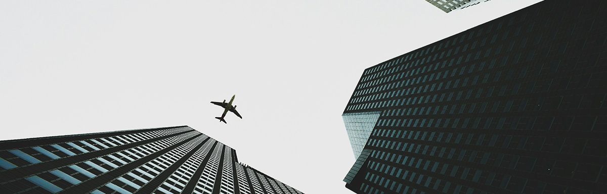 Modern city buildings reaching toward financial success