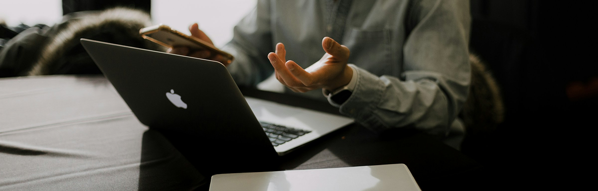 Professional workspace with laptop and financial planning materials